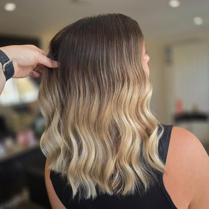 Dimensional blonde waves created at The Hair Therapy Lounge